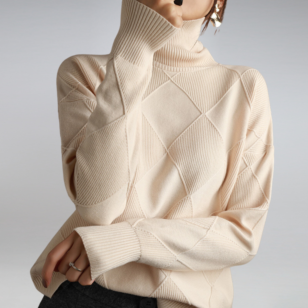 Beige turtleneck sweater with diamond pattern on a plain background